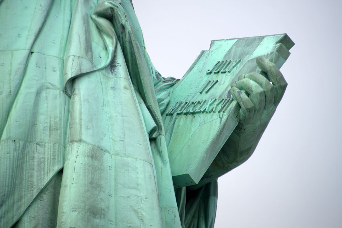 10-04 Statue Of Liberty Hand Holding The Book With Inscription JULY IV MDCCLXXVI July 4, 1776 Close Up From Walk Around Liberty Island